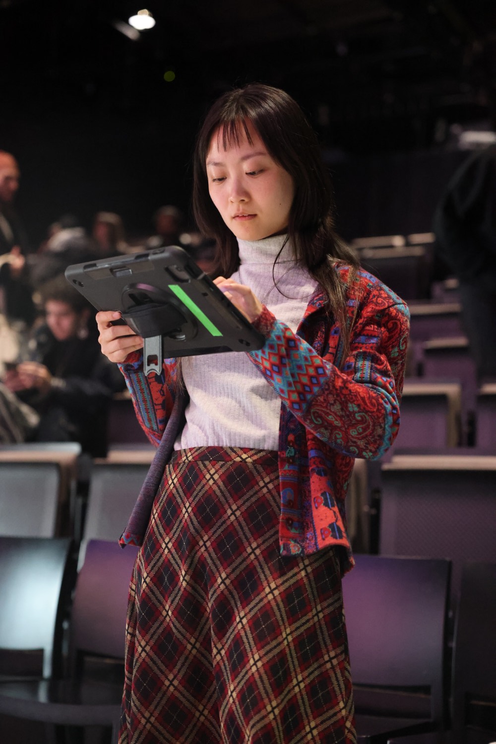 Crew member checking the running order