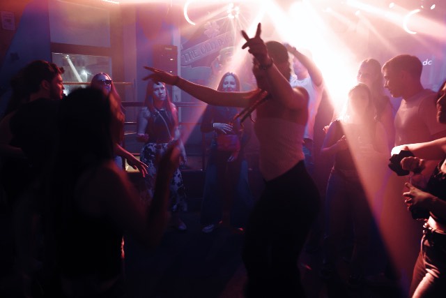 Crowd dancing under the lights