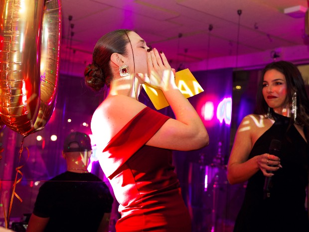 A guest celebrating at the party