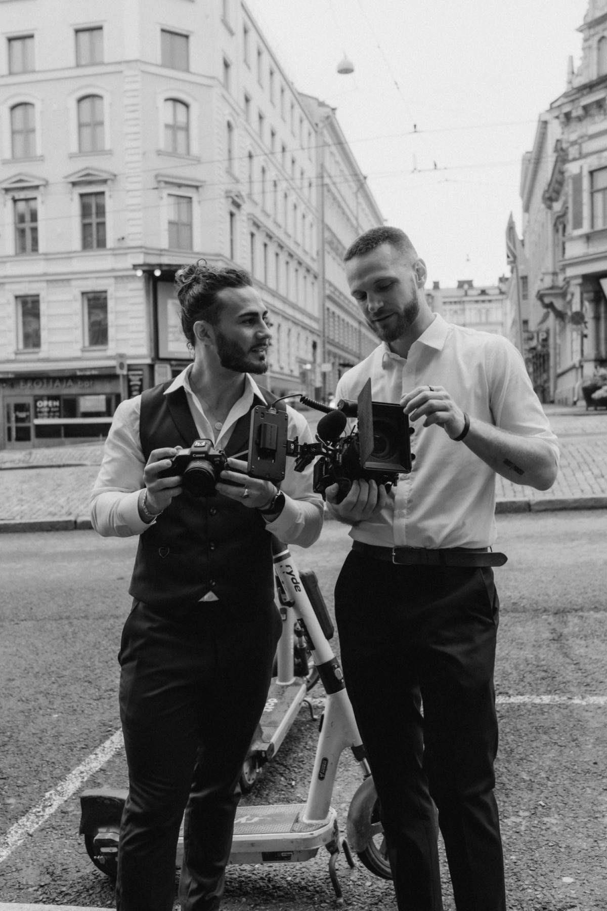Two filmmakers checking a shot on a Helsinki street